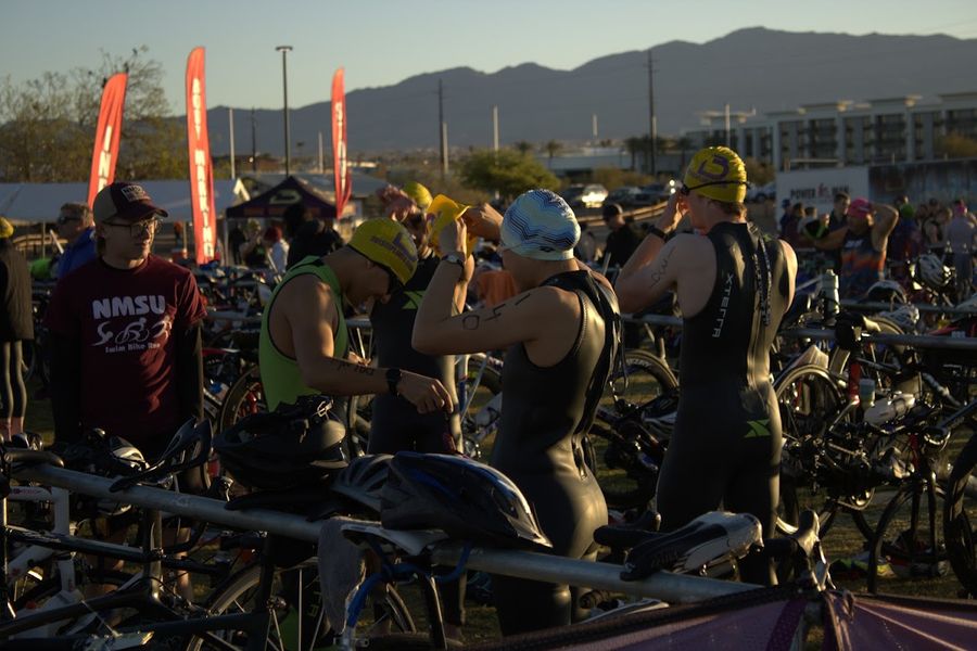 NMSU Triathlon team putting on wetsuits before the race
